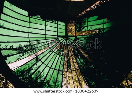 This is an interior view of a unique greenhouse /conservatory ceiling at the long abandoned and historic Dunnington Mansion in Farmville, Virginia.