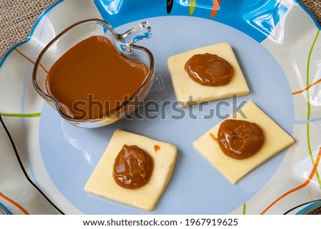 Traditional brazilian dessert with melted caramel and cheese.  Called dulce de Leche in Argentina and doce de leite in Brazil. Combination of cheese with 'milk caramel sauce'