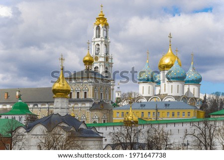 View of the domes of the Holy Trinity Lavra of St. Sergius on a cloudy April day. Sergiev Posad. Moscow region, Russia