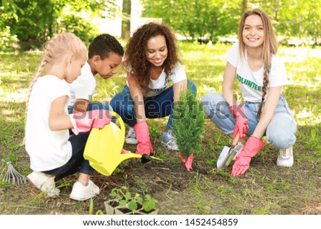 Similar – Image, Stock Photo Adult and children volunteers collecting garbage on the sea beach. Beach environment pollution. Tidying up rubbish on beach. People wear orange gloves picking garbage up in to yellow bag.