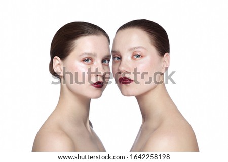 Portrait of two young beautiful girls with clean eye makeup 