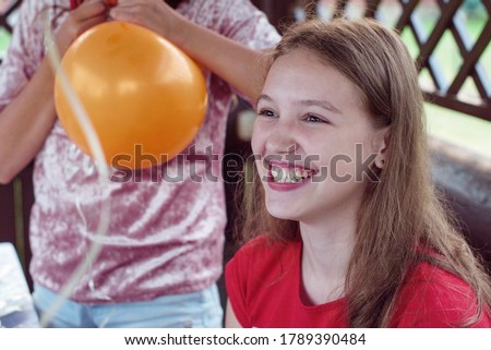 happy smiling teen girl at birthday party