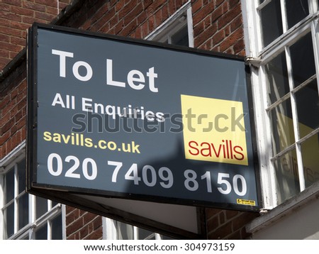 Newbury, Northbrook Street, Berkshire, England - August 07, 2015: Shop to let advertising sign over vacant premises