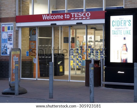 Feltham, London, Middlesex, England - August 04, 2015: Tesco supermarket main entrance to store, company founded by Jack Cohen in 1919