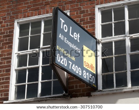 Newbury, Northbrook Street, Berkshire, England - August 07, 2015: Shop to let advertising sign over vacant premises