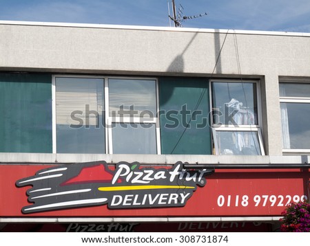 Wokingham, Peach Street, Berkshire, England - August 22, 2015: Pizza hut sign above restaurant, international franchise with over 11,000 branches worldwide