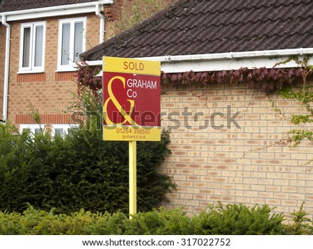 Andover, Hampshire, England - September 13, 2015: estate agent residential house for sold sign
