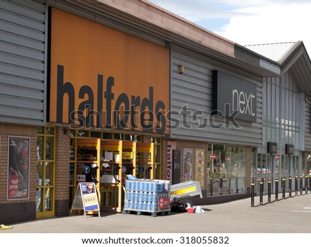 Andover, Retail Park, Hampshire, England - September 18, 2015: Halfords Group plc store, UK retailer of car parts, car enhancement, camping, touring and bicycles, founded in 1892