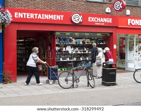Winchester High Street, Hampshire, England - July 31, 2015: Entertainment Exchange store, retail chain buying and selling, DVD, video games, digital devices, phones and laptops