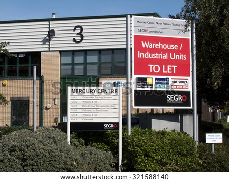 Feltham, London, Central Way, Middlesex, England - September 28, 2015: Commercial estate agent warehouse and industrial units to let advertising sign