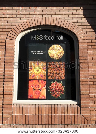 Andover, High Street, Hampshire, England - October 2, 2015: Marks and Spenser food hall window display, company founded in 1884 by Michael Marks and Thomas Spenser