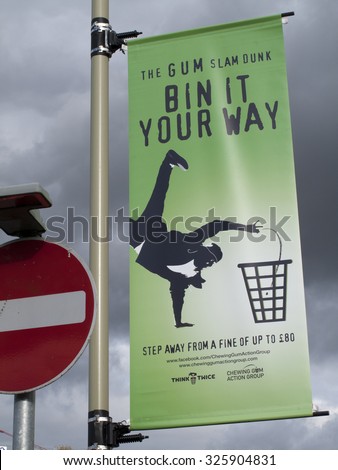Andover, west Street, Hampshire, England - October 10, 2015: Advertising campaign to dispose of chewing gum responsibly, clean up cost local councils 60 million pounds per annum