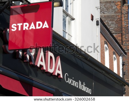 Newbury, Market Place, Berkshire, England - October 10, 2015: Strada Italian restaurant sign over premises, UK chain of restaurants specialising in Italian cuisine