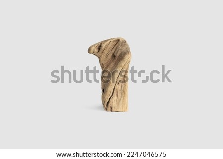 Old wooden figurine isolated on white background. Timber totem Imagine de stoc © 