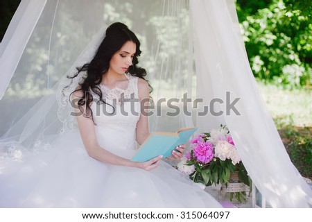Bride on the nature of reading a book, decor, peonies, flowers, lifestyle, marriage, family, love