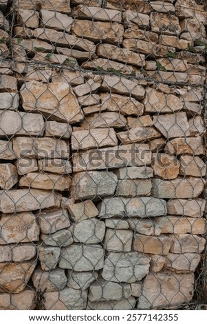 Similar – Image, Stock Photo Stone in wire mesh wall