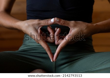 Latin American woman's hands with open and outstretched hands doing the Yoni Mudra or female adi shakti hand gesture. Unrecognizable. Yoga and meditation concept Stock fotó © 