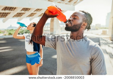 Image, Stock Photo Woman drinking isotonic drink while resting