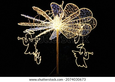 Glowing Christmas angels playing the pipe. Selective focus. High quality photo 商業照片 © 