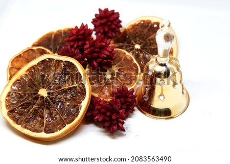 Christmas decorations closeup, golden bell, pines and oranges slices partially slightly unfocused . High quality photo ストックフォト © 