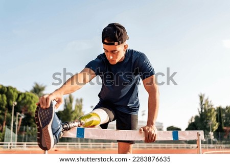 Similar – Image, Stock Photo Disabled man athlete stretching with leg prosthesis.