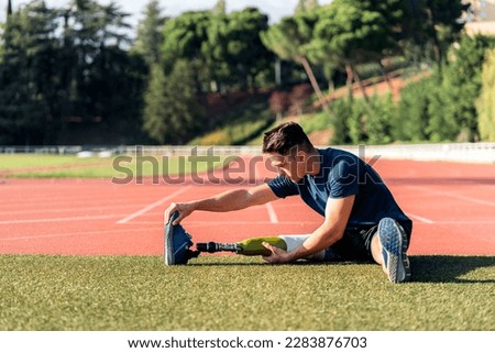 Similar – Image, Stock Photo Disabled man athlete stretching with leg prosthesis.