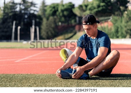 Similar – Image, Stock Photo Disabled man athlete stretching with leg prosthesis.