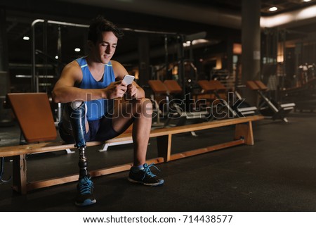 Similar – Image, Stock Photo Disabled athlete using phone