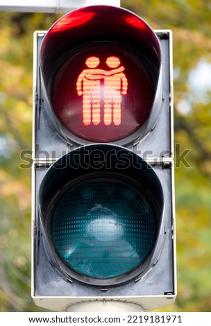 Similar – Image, Stock Photo LGBT pedestrian traffic light signals symbolizing equality