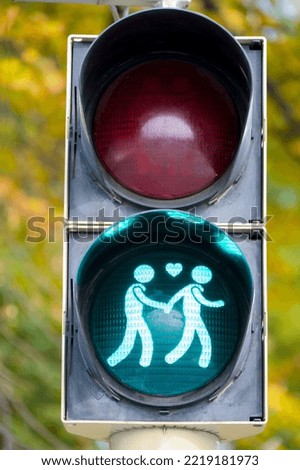 Similar – Image, Stock Photo LGBT pedestrian traffic light signals symbolizing equality