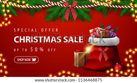Special offer, Christmas sale, up to 50% off, beautiful red discount banner with Christmas tree branches, garlands and Santa Claus bag with presents