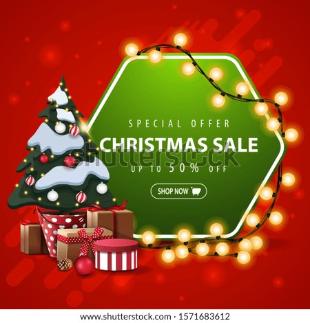 Special offer, Christmas sale, up to 50% off, square red and green banner with hexagonal sign wrapped garland and Christmas tree in a pot with gifts