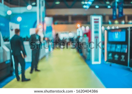 Exhibition background blur- expo defocused.  Presentation company- be focused business bokeh. People group- booth technology