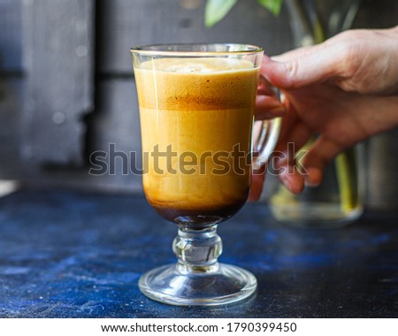 latte or cappuccino dalgona coffee in a transparent glass sweet hot drink cocoa with milk organic eating healthy top view place for text copy space