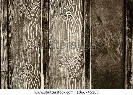 texture of a wooden board of monochrome brown sepia tone for the abstract background or wallpaper
