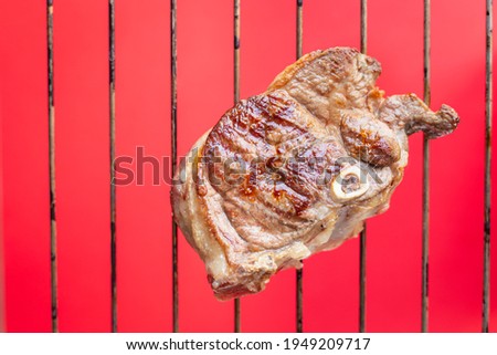 grilled meat barbecue piece of meat on the bone of ossobuco pork beef lamb trend meal copy space food background rustic. top view