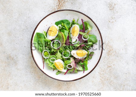 Similar – Image, Stock Photo Spinach salad with eggs avocados tomatoes and mozzarella cheese