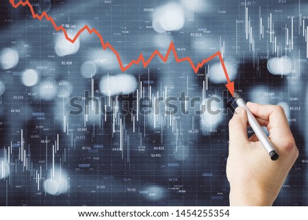 Hand drawing downward red arrow on blurry city background. Decrease, growth and economy concept. Multiexposure  ストックフォト © 