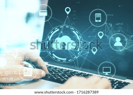Hands tayping on laptop with online shopping  diagram. Cloud computing and communication concept. Double exposure