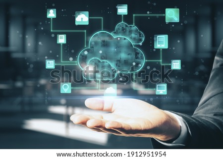 Cloud computing concept with digital screen with glowing cloud and application icons above man hand at abstract background