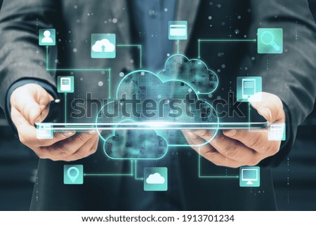 Cloud computing technology with digital screen with application icons and businessman holding digital tablet