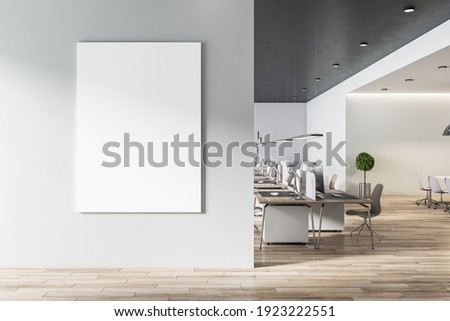 Blank white poster on light grey wall in modern open space office with light furniture and wooden floor. Mock up. 3D rendering ストックフォト © 