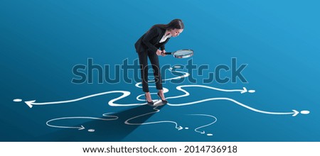 Choice and find your way concept with businesswoman looking through a magnifying glass on arrow roads drawn on bright blue surface