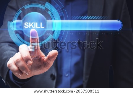 Close up of businessman hand pointing at abstract glowing skill bar. Training, education, technology and improvement concept