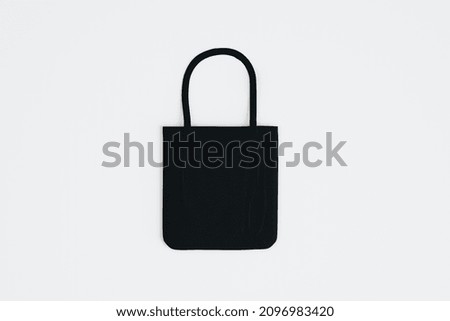 Top view and close up of empty black shopper on white background. Mock up, advertisement, 3D Rendering
