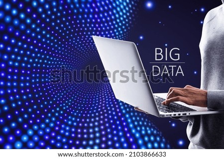 Close up of hands using laptop on creative big data flow background. Technology, cyberspace, science and digital stream concept