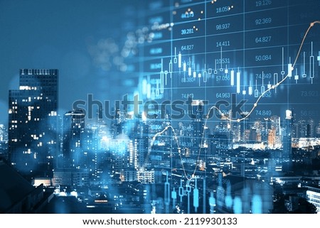 Abstract glowing big data forex candlestick chart on blurry city backdrop. Trade, technology, investment and analysis concept. Double exposure