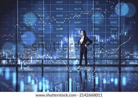 Attractive young european businesswoman standing in dark office interior with big data index, forex chart and city view. Double exposure