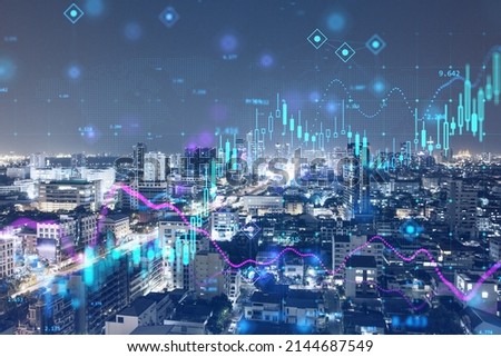 Abstract glowing candlestick forex chart on illuminated night city background. Trade and stock concept