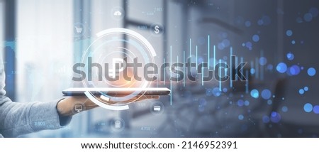 Close up of female hand holding tablet with creative glowing round ruble chart hologram on blurry office interior background with bokeh circles. Currency, finance and online banking concept. 
